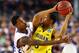 ARLINGTON, TX - MARCH 29: Ben McLemore #23 of the Kansas Jayhawks defends against Trey Burke #3 of the Michigan Wolverines in the first half during the South Regional Semifinal round of the 2013 NCAA Men's Basketball Tournament at Dallas Cowboys Stadium on March 29, 2013 in Arlington, Texas. (Photo by Tom Pennington/Getty Images)