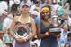Jun 8, 2013; Paris, France; Serena Williams (USA), right, and Maria Sharapova (RUS) pose with their trophies after their match on day 14 of the 2013 French Open at Roland Garros. Mandatory Credit: Susan Mullane-USA TODAY Sports