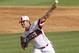 Jun 8, 2013; Raleigh, NC, USA; North Carolina State Wolfpack pitcher Carlos Rodon delivers a pitch against the Rice Owls during the Raleigh super regional of the 2013 NCAA baseball tournament at Doak Field. North Carolina State defeated Rice 4-3. Mandatory Credit: Jeremy Brevard-USA TODAY Sports