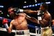 NEW YORK, NY - JUNE 22: Adrien Broner (R) lands a right on Paulie Malignaggi during their WBA Welterweight Title bout at Barclays Center on June 22, 2013 in the Brooklyn borough of New York City. (Photo by Al Bello/Getty Images)
