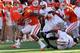CLEMSON, SC - NOVEMBER 17: Roderick McDowell #25 of the Clemson Tigers runs with the ball against the defense of the North Carolina State Wolfpack during their game at Memorial Stadium on November 17, 2012 in Clemson, South Carolina. (Photo by Streeter Lecka/Getty Images)