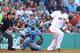BOSTON, MA - JUNE 19: David Ortiz #34 of the Boston Red Sox hits a single in the bottom of the second inning in a game against the Tampa Bay Rays on June 19, 2013 in Boston, Massachusetts. (Photo by Gail Oskin/Getty Images)
