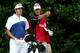 Bubba Watson and caddie, Ted Scott, discuss a shot.