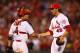 ST. LOUIS, MO - JUNE 20: Yadier Molina #4 and reliever Kevin Siegrist #46 both of the St. Louis Cardinals congratulate each other after beating the Chicago Cubs at Busch Stadium on June 20, 2013 in St. Louis, Missouri. The Cardinals beat the Cubs 6-1. (Photo by Dilip Vishwanat/Getty Images)