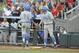 Jun 24, 2013; Omaha, NE, USA; UCLA Bruins third baseman Kevin Kramer (7) is congratulated by first baseman Pat Gallagher (27) for scoring on a RBI-single by shortstop Pat Valaika (not pictured) during the first inning in game 1 of the College World Series finals against the Mississippi State Bulldogs at TD Ameritrade Park. Mandatory Credit: Dave Weaver-USA TODAY Sports