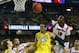 ATLANTA, GA - APRIL 08: Gorgui Dieng #10 of the Louisville Cardinals goes for the ball over Jordan Morgan #52 of the Michigan Wolverines in the second half during the 2013 NCAA Men's Final Four Championship at the Georgia Dome on April 8, 2013 in Atlanta, Georgia. (Photo by Streeter Lecka/Getty Images)