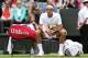 LONDON, ENGLAND - JUNE 24: Roger Federer of Switzerland takes a break during his gentlemen's singles first round match against Victor Hanescu of Romania on day one of the Wimbledon Lawn Tennis Championships at the All England Lawn Tennis and Croquet Club on June 24, 2013 in London, England. (Photo by Clive Brunskill/Getty Images)