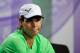 LONDON, ENGLAND - JUNE 24: Rafael Nadal of Spain reacts as he speaks to members of the media during a press conference following his defeat to Steve Darcis of Belgium in their Gentlemen's Singles first round match on day one of the Wimbledon Lawn Tennis Championships at the All England Lawn Tennis and Croquet Club on June 24, 2013 in London, England. (Photo by Thomas Lovelock/AELTC - Pool/Getty Images)