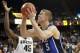 Jan 30, 2013; Winston Salem, NC, USA; Duke Blue Devils forward Mason Plumlee (5) goes up for a shot while Wake Forest Demon Deacons forward Arnaud William Adala Moto (45) defends during the second half at Lawrence Joel Veterans Memorial Coliseum. Duke won 75-70. Mandatory Credit: Jeremy Brevard-USA TODAY Sports