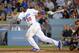 Jun 24, 2013; Los Angeles, CA, USA; Los Angeles Dodgers center fielder Yasiel Puig (66) follows through on a run-scoring single in the eighth inning against the San Francisco Giants at Dodger Stadium. The Dodgers defeated the Giants 2-1. Mandatory Credit: Kirby Lee-USA TODAY Sports