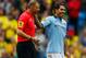 MANCHESTER, ENGLAND - MAY 19: Carlos Tevez (R) of Manchester City shares a moment with referee Mark Halsey as he is substituted during the Barclays Premier League match between Manchester City and Norwich City at the Etihad Stadium on May 19, 2013 in Manchester, England. (Photo by Paul Thomas/Getty Images)
