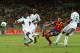 FORTALEZA, BRAZIL - JUNE 23: David Villa of Spain shoots past Efe Ambrose (5) and Godfrey Oboabona (2) of Nigeria during the FIFA Confederations Cup Brazil 2013 Group B match between Nigeria and Spain at Castelao on June 23, 2013 in Fortaleza, Brazil. (Photo by Robert Cianflone/Getty Images)