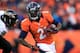 DENVER, CO - JANUARY 12: Ronnie Hillman #21 of the Denver Broncos runs with the ball against the Baltimore Ravens during the AFC Divisional Playoff Game at Sports Authority Field at Mile High on January 12, 2013 in Denver, Colorado. The Ravens won 38-35 in 2 overtimes. (Photo by Doug Pensinger/Getty Images)