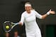 LONDON, ENGLAND - JUNE 24: Victoria Azarenka of Belarus plays a forehand during her Ladies' Singles first round match against Maria Joao Koehler of Portugal on day one of the Wimbledon Lawn Tennis Championships at the All England Lawn Tennis and Croquet Club on June 24, 2013 in London, England. (Photo by Mike Hewitt/Getty Images)