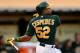 OAKLAND, CA - JUNE 25: Yoenis Cespedes #52 of the Oakland Athletics hits an RBI single scoring Coco Crisp #4 in the third inning against the Cincinnati Reds at O.co Coliseum on June 25, 2013 in Oakland, California. (Photo by Thearon W. Henderson/Getty Images)