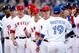KANSAS CITY, MO - JULY 10: American League All-Star C.J. Wilson (C) #33 of the Los Angeles Angels of Anaheim waits to greet fellow All-Star Jose Bautista #19 of the Toronto Blue Jays during the 83rd MLB All-Star Game at Kauffman Stadium on July 10, 2012 in Kansas City, Missouri. (Photo by Jamie Squire/Getty Images)