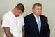 Jun 26, 2013; North Attleborough, MA, USA; New England Patriots former tight end Aaron Hernandez (left) stands with his attorney Michael Fee as he is arraigned in Attleboro District Court. Hernandez is charged with first degree murder in the death of Odin Lloyd. Mandatory Credit: The Sun Chronicle/Pool Photo via USA TODAY Sports