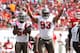 October 14, 2012; Tampa, FL, USA; Tampa Bay Buccaneers outside linebacker Lavonte David (54) and defensive tackle Gerald McCoy (93) gets the fans pumped up and reacts against the Kansas City Chiefs during the second quarter at Raymond James Stadium. Mandatory Credit: Kim Klement-USA TODAY Sports