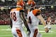 August 16, 2012; Atlanta, GA, USA; Cincinnati Bengals wide receiver A.J. Green (18) celebrates with quarterback Andy Dalton (14) after scoring a touchdown in the second quarter against the Atlanta Falcons at the Georgia Dome. Mandatory Credit: Daniel Shirey-USA TODAY Sports