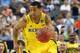 Mar 31, 2013; Arlington, TX, USA; Michigan Wolverines guard Trey Burke (3) drives against the Florida Gators in the first half during the South regional final of the 2013 NCAA Tournament at Cowboys Stadium. Mandatory Credit: Matthew Emmons-USA TODAY Sports