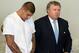 Jun 26, 2013; North Attleborough, MA, USA; New England Patriots former tight end Aaron Hernandez (left) stands with his attorney Michael Fee as he is arraigned in Attleboro District Court. Hernandez is charged with first degree murder in the death of Odin Lloyd. Mandatory Credit: The Sun Chronicle/Pool Photo via USA TODAY Sports