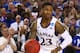 ARLINGTON, TX - MARCH 29: Ben McLemore #23 of the Kansas Jayhawks drives against the Michigan Wolverines during the South Regional Semifinal round of the 2013 NCAA Men's Basketball Tournament at Dallas Cowboys Stadium on March 29, 2013 in Arlington, Texas. (Photo by Ronald Martinez/Getty Images)