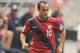WASHINGTON, DC - JUNE 19: Landon Donovan #10 of the United States dribbles the ball against Jamaica during the 2011 Gold Cup Quarterfinals on June 19, 2011 at RFK Stadium in Washington, D.C. The United States won 2-0. (Photo by Mitchell Layton/Getty Images)