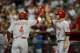 PHOENIX, AZ - JUNE 23: Brandon Phillips #4 of the Cincinnati Reds and teammate Zach Cozart #2 celebrate Phillip's home run against the Arizona Diamondbacks at Chase Field on June 23, 2013 in Phoenix, Arizona. (Photo by Norm Hall/Getty Images)