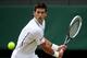 LONDON, ENGLAND - JUNE 29: Novak Djokovic of Serbia plays a backhand during the Gentlemen's Singles third round match against Jeremy Chardy of France on day six of the Wimbledon Lawn Tennis Championships at the All England Lawn Tennis and Croquet Club on June 29, 2013 in London, England. (Photo by Clive Brunskill/Getty Images)