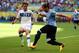 SALVADOR, BRAZIL - JUNE 30: Martin Caceres of Uruguay competes with Alessandro Diamanti of Italy during the FIFA Confederations Cup Brazil 2013 3rd Place match between Uruguay and Italy at Estadio Octavio Mangabeira (Arena Fonte Nova Salvador) on June 30, 2013 in Salvador, Brazil. (Photo by Clive Mason/Getty Images)