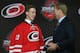 Lindholm and future coach Kirk Muller share a light moment on the stage.