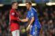 LONDON, ENGLAND - OCTOBER 28: Fernando Torres of Chelsea is helped to his feet by Wayne Rooney of Manchester United after being shown the red card during the Barclays Premier League match between Chelsea and Manchester United at Stamford Bridge on October 28, 2012 in London, England. (Photo by Michael Regan/Getty Images)