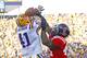 November 17, 2012; Baton Rouge, LA, USA; Ole Miss Rebels linebacker Ralph Williams (44) knocks the ball away from LSU Tigers tight end Travis Dickson (41) during the first half at Tiger Stadium. Mandatory Credit: Crystal LoGiudice-USA TODAY Sports