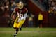 LANDOVER, MD - JANUARY 06: Robert Griffin III #10 of the Washington Redskins runs the ball against the Seattle Seahawks during the NFC Wild Card Playoff Game at FedExField on January 6, 2013 in Landover, Maryland. (Photo by Patrick McDermott/Getty Images)