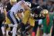 Oct. 20, 2012; South Bend, IN, USA; Notre Dame Fighting Irish running back Theo Riddick (6) carries the ball as BYU Cougars defensive back Daniel Sorensen (9) defends in the fourth quarter at Notre Dame Stadium. Notre Dame won 17-14. Mandatory Credit: Matt Cashore-USA TODAY Sports