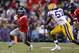 November 17, 2012; Baton Rouge, LA, USA; Ole Miss Rebels running back Jeff Scott (3) carries the ball beside LSU Tigers linebacker Lamin Barrow (57) during the second half at Tiger Stadium. LSU defeated Ole Miss 41-35. Mandatory Credit: Crystal LoGiudice-USA TODAY Sports