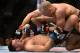 Mar 16, 2013; Montreal, Quebec, CAN; Georges St.Pierre (red) throws punches at Nick Diaz (blue) on the mat during their Welterweight title bout at UFC 158 at the Bell Centre. Mandatory Credit: Eric Bolte-USA TODAY Sports