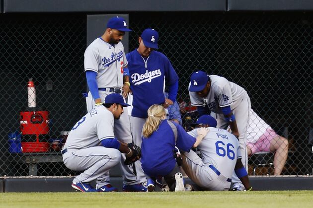 Yasiel Puig Injury: Dodgers of Hits Coors Field Wall, Leaves Game