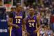 Feb 24, 2013; Dallas, TX, USA; Los Angeles Lakers guard Kobe Bryant (24) speaks with center Dwight Howard (12) during the game against the Dallas Mavericks at the American Airlines Center. Mandatory Credit: Matthew Emmons-USA TODAY Sports