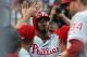 LOS ANGELES, CA - JUNE 28: Domonic Brown #9 of the Philadelphia Phillies celebrates in the dugout after scoring a run against the Los Angeles Dodgers in the first inning at Dodger Stadium on June 28, 2013 in Los Angeles, California. (Photo by Stephen Dunn/Getty Images)