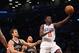 NEW YORK, NY - OCTOBER 19: Jrue Holiday #11 of the Philadelphia 76ers scores on a lay up against the Brooklyn Nets during the first quarter of a preseason game at the Barclays Center on October 19, 2012 in the Brooklyn borough of New York City. NOTE TO USER: User expressly acknowledges and agrees that, by downloading and/or using this photograph, user is consenting to the terms and conditions of the Getty Images License Agreement. (Photo by Bruce Bennett/Getty Images)