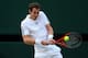 LONDON, ENGLAND - JULY 05: Andy Murray of Great Britain plays a backhand during the Gentlemen's Singles semi-final match against Jerzy Janowicz of Poland on day eleven of the Wimbledon Lawn Tennis Championships at the All England Lawn Tennis and Croquet Club on July 5, 2013 in London, England. (Photo by Julian Finney/Getty Images)