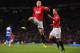 MANCHESTER, ENGLAND - MARCH 16: Wayne Rooney of Manchester United celebrates scoring the opening goal during the Barclays Premier League match between Manchester United and Reading at Old Trafford on March 16, 2013 in Manchester, England. (Photo by Michael Regan/Getty Images)