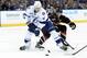 Apr 21, 2013; Tampa, FL, USA; Carolina Hurricanes center Eric Staal (12) defends Tampa Bay Lightning center Vincent Lecavalier (4) and forces a steal during the second period at the Tampa Bay Times Forum. Mandatory Credit: Kim Klement-USA TODAY Sports