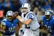 Dec. 2, 2012; Detroit, MI, USA; Indianapolis Colts quarterback Andrew Luck (12) scrambles out of the pocket while being pressured by Detroit Lions defensive tackle Ndamukong Suh (90) and defensive tackle Nick Fairley (98) in the second quarter at Ford Field. Mandatory Credit: Andrew Weber-USA TODAY Sports