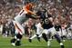 Jan 7, 2012; Houston, TX, USA; Cincinnati Bengals offensive tackle Andre Smith (71) blocks Houston Texans outside linebacker Brooks Reed (58) during the fourth quarter of the 2011 AFC Wild Card Playoff game at Reliant Stadium. Mandatory Credit: Thomas Campbell-US Presswire
