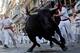 PAMPLONA, SPAIN - JULY 11: A fighting bull goes around Estafeta corner on the sixth day of the San Fermin running-of-the-bulls on July 11, 2011 in Pamplona, Spain. Pamplona's famous Fiesta de San Fermin, which involves the running of the bulls through the historic heart of Pamplona for eight days starting July 7th, was made famous by the 1926 novel of U.S. writer Ernest Hemmingway called 'The Sun Also Rises.' (Photo by Denis Doyle/Getty Images)
