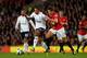 MANCHESTER, ENGLAND - SEPTEMBER 29: Mousa Dembele of Tottenham Hotspur and Michael Carrick of Manchester United battle for the ball during the Barclays Premier League match between Manchester United and Tottenham Hotspur at Old Trafford on September 29, 2012 in Manchester, England. (Photo by Shaun Botterill/Getty Images)