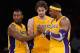 LOS ANGELES, CA - NOVEMBER 16: Metta World Peace #15 and Pau Gasol #16 of the Los Angeles Lakers help Dwight Howard #12 with his contact lens during the basketball game against Phoenix Suns at Staples Center on November 16, 2012 in Los Angeles, California. NOTE TO USER: User expressly acknowledges and agrees that, by downloading and or using this photograph, User is consenting to the terms and conditions of the Getty Images License Agreement. (Photo by Kevork Djansezian/Getty Images)