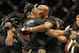 Jul 6, 2013; Las Vegas, NV, USA; Chris Weldman (blue shorts) hugs Anderson Silva after their Middleweight Chamionship Bout at the MGM Grand Garden Arena. Chris Weidman defeated Anderson in a TKO in the second round. Mandatory Credit: Jayne Kamin-Oncea-USA TODAY Sports